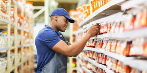 A stock image of a supermarket attendant