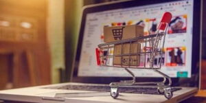 An image portraying a laptop and a shopping cart.