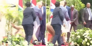 A soldier trips and falls during the royal visit by King Charles III and Queen Camilla at State House in Nairobi on October 31, 2023. 