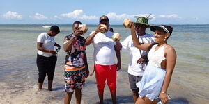 Conjestina Achieng (2nd from left) with Mike Sonko (centre) on June 12 at Salama Bling Beach Resort in Mombasa.