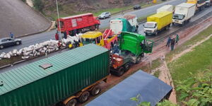 A photo of a trailer ramming into a bridge along the Southern Bypass Road on November 21, 2023. 