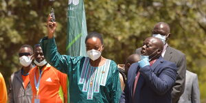 Cabinet Secretary for Defence Dr. Monica Juma fires the starter’s gun to start the main event being the 10 km men’s race at this year’s KDF Annual Cross-country Championships held at Moi Airbase in Eastleigh Nairobi on Friday 29 January 2021.