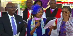 Stella Wanjiru (centre) addresses the funeral service of Lizzie Wanyoike, the founder of the Nairobi Institute of Business Studies (NIBS) in Murang'a County on January 23, 2024. 