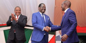 Former President Uhuru Kenyatta onlooks as President William Ruto greets former Prime Minister Raila Odinga during the National Prayer Breakfast on May 26, 2022.