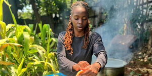 A photo of content creator Sueh Owino preparing a meal for her husband on September 27, 2023.