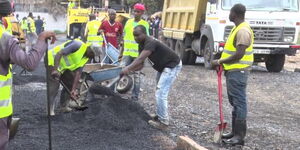 Road contractors recarpeting a road in Nairobi 