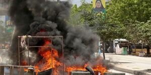 A bonfire along a road in Tanzania during elections protests on Wednesday, October 29.