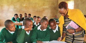 File image of a teacher and students in class 