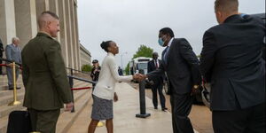 the deputy assistant secretary of defense for African affairs, greets Kenya Cabinet Defense Secretary Eugene L. Wamalwa at the Pentagon in Arlington, Va., May 4, 2022.