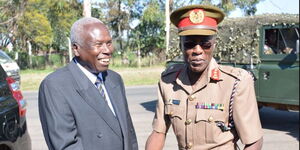 General (Rtd) Daudi Tonje (left) greets a military officer during a visit to the Kenya Military Academy on November 29, 2017.