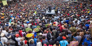 Traders in Kitali town, Trans Nzoia County listening to President William Ruto on January 17, 2024