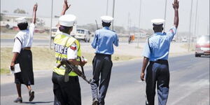 A photo of Kenyan Traffic Police Officers manning a highway 