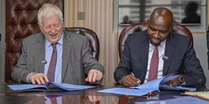 Transport Cabinet Secretary Kipchumba Murkomen (right) sings a deal with an officials from the Netherlands.