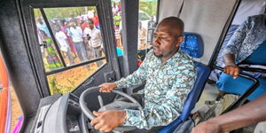 Transport CS Kipchumba Murkomen drives a bus at Liter Girls High School.