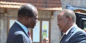 President Uhuru Kenyatta (right) with Jubilee Secretary-General Raphael Tuju (left) at the All Saints Cathedral, Nairobi in October 2015