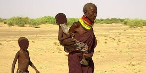 An undated image of children accompanying their mother in Turkana County