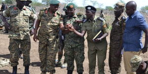 Uganda Army and police officers display the guns recovered during the operation in Moroto District on Saturday, April, 8. 