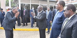 President Uhuru Kenyatta (left) greets his deputy William Ruto at Parliament buildings on Monday, April 25, 2022