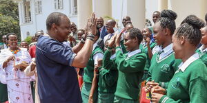 President Uhuru Kenyatta interacts with students of Nyiro Girls’ Secondary School, Samburu County at State House, Nairobi after donating a bus to the school on Friday, November 1, 2019.
