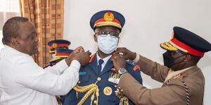 Former President Uhuru Kenyatta (left) and Chief of Defence Forces Francis Ogolla at State House.