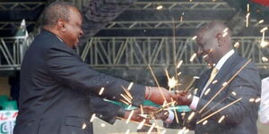 An image of former president Uhuru Kenyatta handing over the Sword to President William Ruto at Kasarani Stadium, Nairobi.