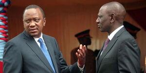 Former President Uhuru Kenyatta and President William Ruto engaging in a discussion in Nairobi on March 6, 2019. 