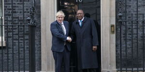 Former President Uhuru Kenyatta (left) shakes hands with former UK Prime Minister Boris Johnson at Downing Street, London on January 22, 2020.
