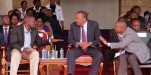 President Uhuru Kenyatta (centre) with DP William Ruto (left) and Tharaka Nithi Senator Kithure Kindiki (right) during a political event.