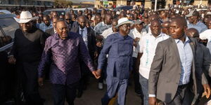 Former President Uhuru Kenyatta (left) and Azimio leader Raila Odinga attend a funeral in Yala, Siaya County on February 11, 2023. 