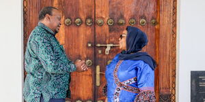 Former President Uhuru Kenyatta (left) holds talks with Tanzanian Head of State Samia Suluhu in Zanzibar on February 21, 2024.