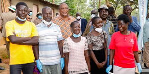 President Uhuru Kenyatta and ODM leader Raila Odinga with a family in Gem, Siaya County on May 30, 2021.