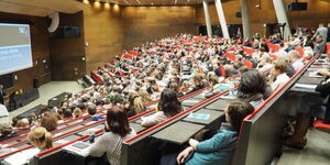 University students attending a class at an institution in Vienna, Austria