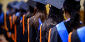 University students standing in line during graduation