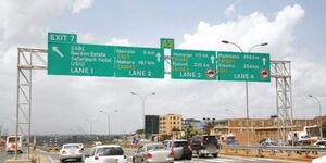 Vehicles pictured along a highway. 