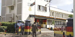 Members of public outside a police station. 