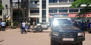 A Ugandan police vehicle outside a crime scene where a lender was shot on May 12, 2023.