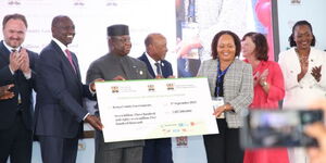 President William Ruto hands over a Ksh7 billion check to Council of Governors (CoG) chair Anne Waiguru on September 4, 2023.