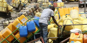 Water Vendors wait for their turn to fetch water at Kitengela on July 21, 2018.