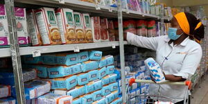 A Kenyan purchasing wheat flour at a local supermarket. 