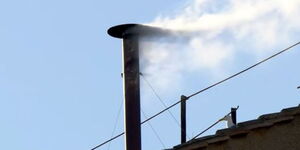hite smoke billows from the sinister chimney