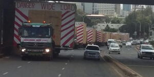 Trucks transporting Wide Loads on the road.