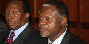 Former Kenya Power and Lighting managing director Samuel Gichuru (left) and former Finance minister Chris Okemo during a past court proceedings.