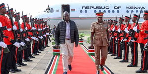 President William Ruto inspects a guard of honour at JKIA after returning to the country on March 30, 2023.