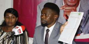Presidential candidate Muthiora Kariara unveils his running-mate Miriamu Mutua (left) at a function held at Kenya National Theatre on Tuesday, May 10.