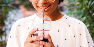 woman sipping from straw