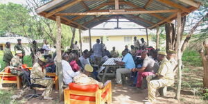 KWS officials and members of the community during a meeting on issues of human-wildlife conflicts at Mbirikani on May 13, 2023.