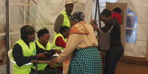 Images of voters at a polling station in Kabete