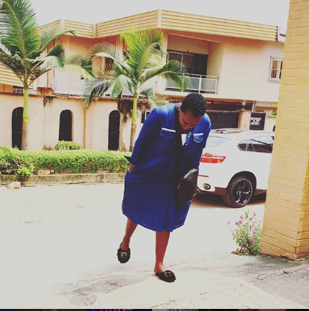 Emmy Kosgei poses for a photo in front of her house on November 14, 2019