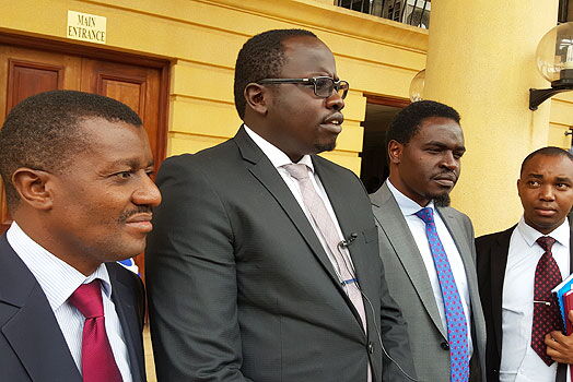 Lawyers Daniel Maanzo, Ham Langat (centre) and Nelson Havi address journalists at the Miliamani law courts on January 10, 2018.