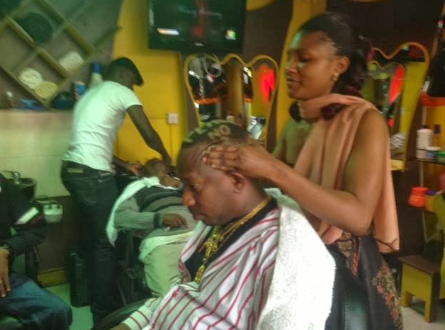 Nairobi Governor Mike Sonko's long-time barber pictured serving him at her shop in Nairobi's Buru Buru estate in 2016